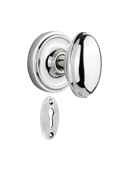 Classic Rosette Mortise-Lock Set with Homestead Knobs in Polished Chrome.